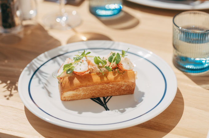A dish from the Deck 4 menu on a white plate with a blue rim.